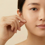 Image of lady pinching her skin, suggesting skin firmness